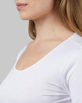 Women’s lightweight scoop neck baselayer top in white with soft breathable stretch fabric from The Zayaan

