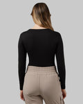 Women’s lightweight scoop neck baselayer top in black with moisture-wicking stretch fabric from The Zayaan
